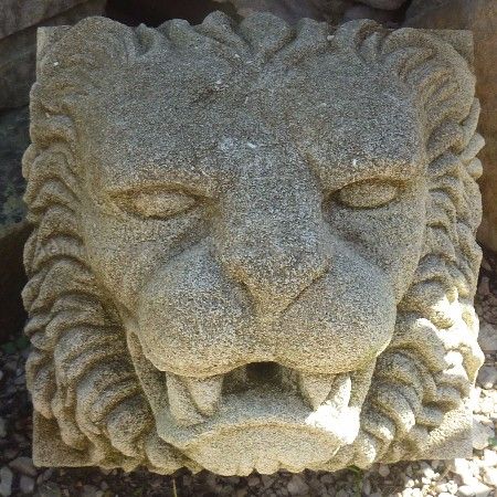 Sculpture of a lion's head carved in natural stone by the Alain Bidal workshop, Provence